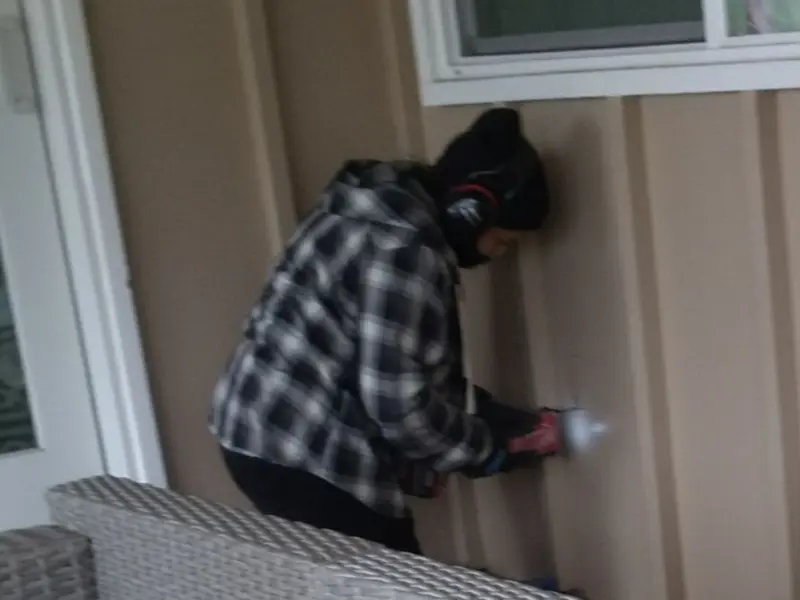 Professional electrician installing an exterior outlet in Heidelberg